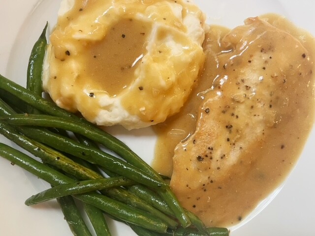 This skillet chicken with onion gravy has a comforting homemade taste and feel. It's quick to make, but it tastes like it's been cooking all day!