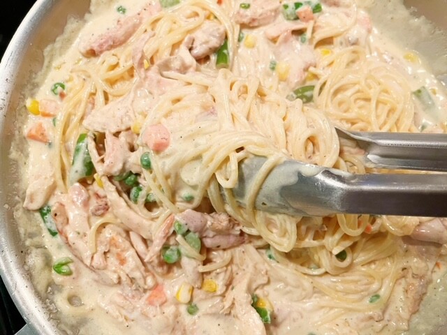 This alfredo pasta will be loved by your whole family! By using frozen veggies and rotisserie chicken, you'll have dinner ready so quickly.