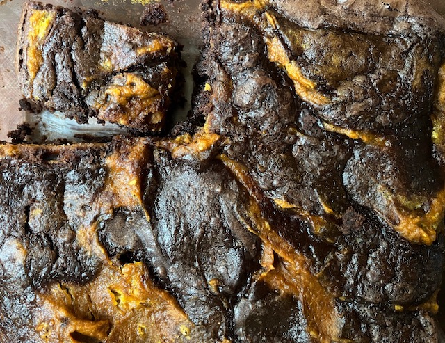 Looking for a fall-inspired dessert? Try these easy pumpkin brownies! Combine a box of brownie mix with a simple pumpkin batter to get a swirled and fudgy treat.